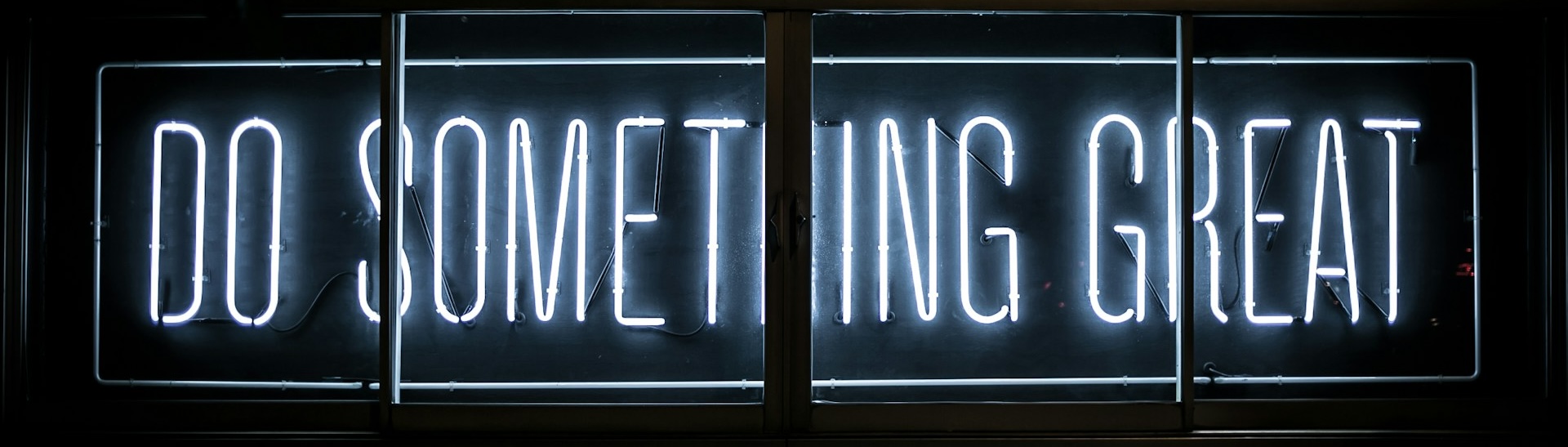 A neon sign saying do something great